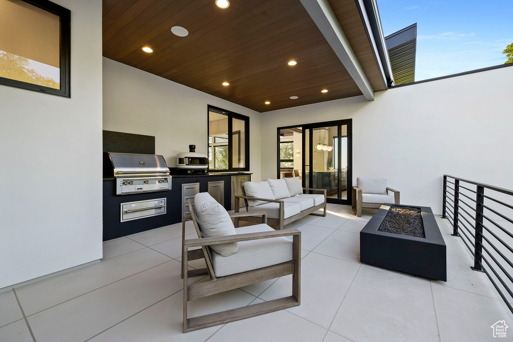 View of patio / terrace with an outdoor hangout area, a grill, and area for grilling