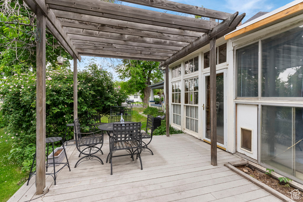 Wooden terrace with a pergola