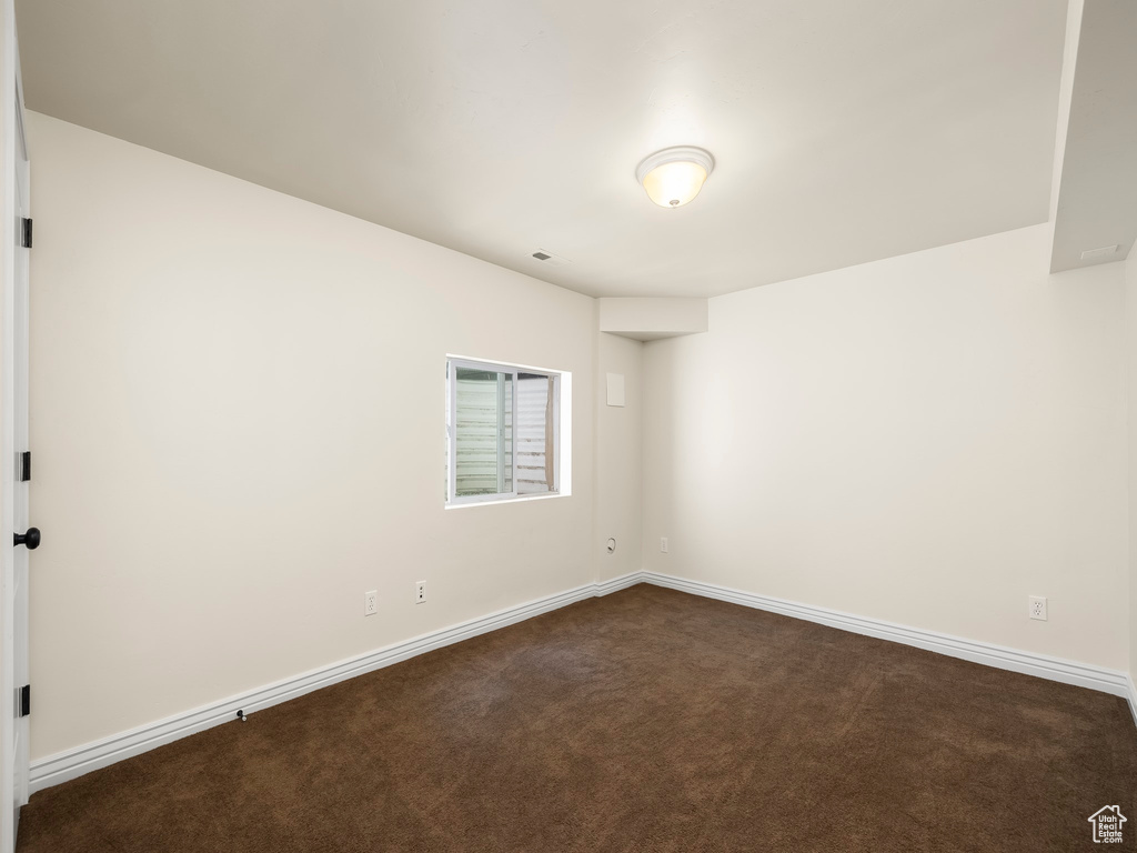 View of carpeted spare room