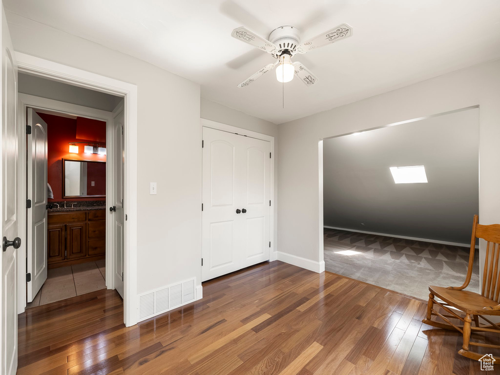 Entryway featuring ceiling fan and hardwood / wood-style flooring