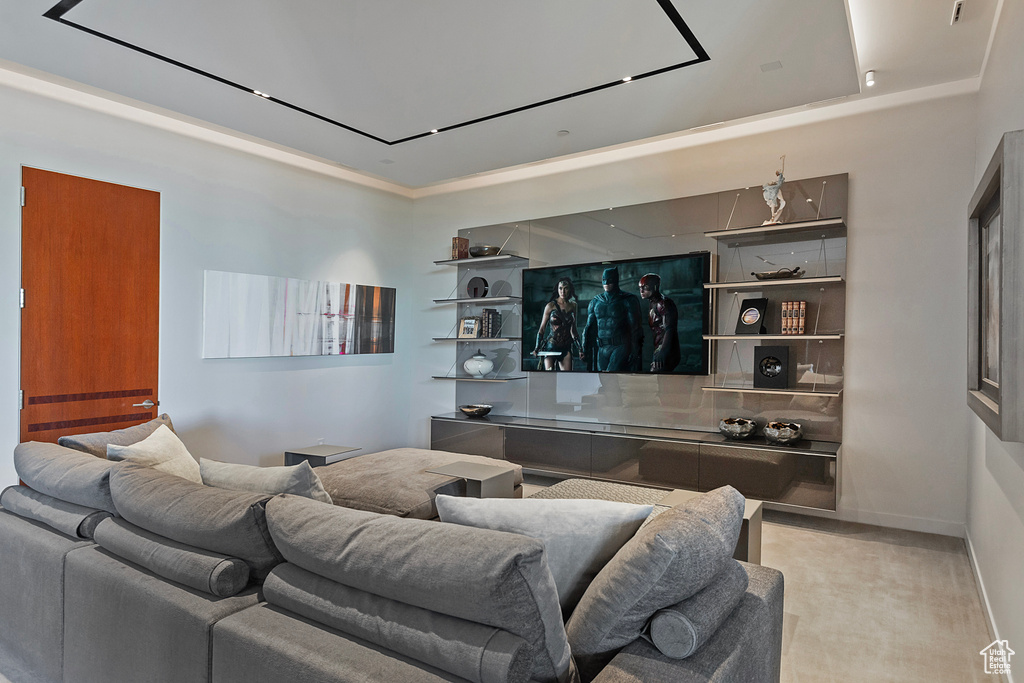 Living room featuring a tray ceiling