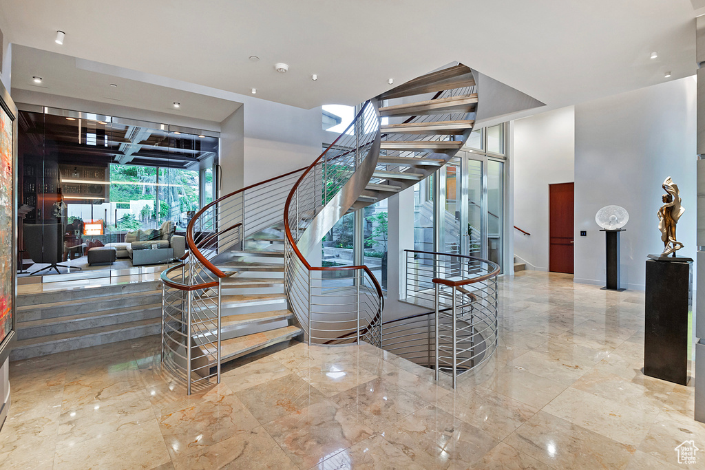 Staircase featuring tile floors