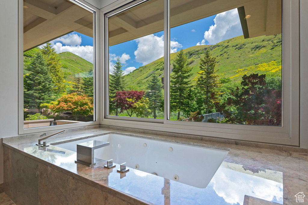 Bathroom with a mountain view and a wealth of natural light