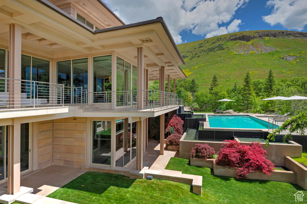 Exterior space featuring a mountain view and a balcony