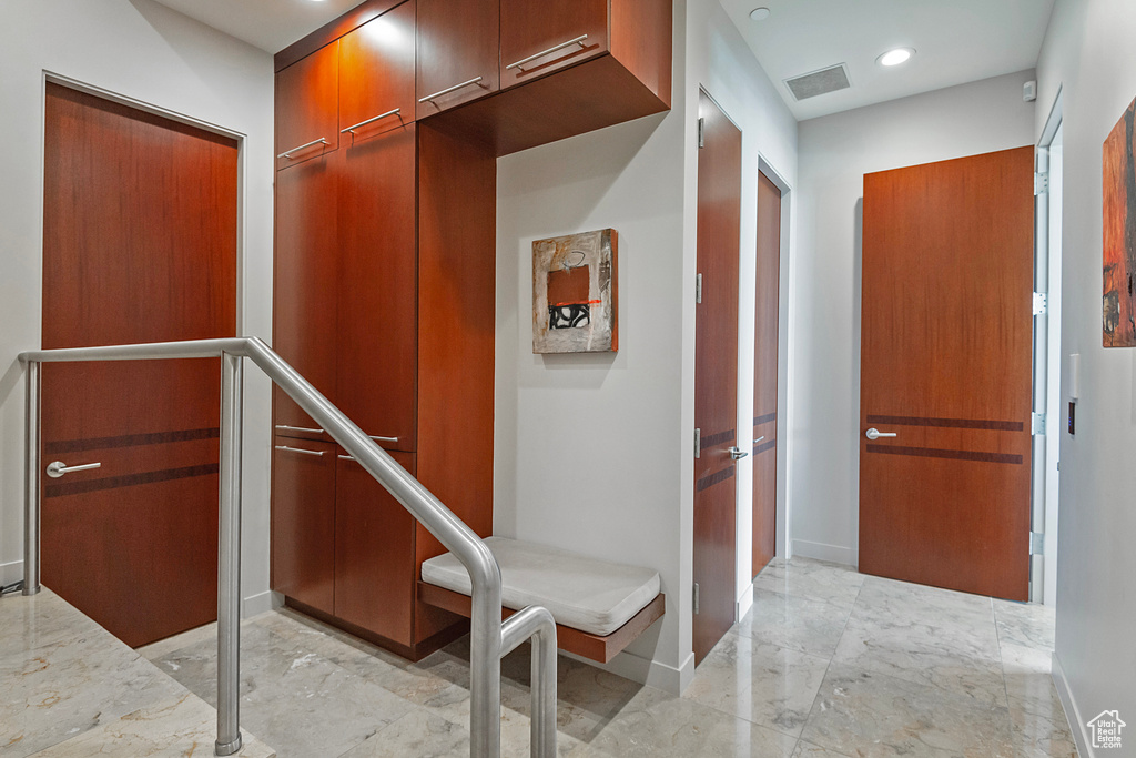 Corridor with light tile flooring