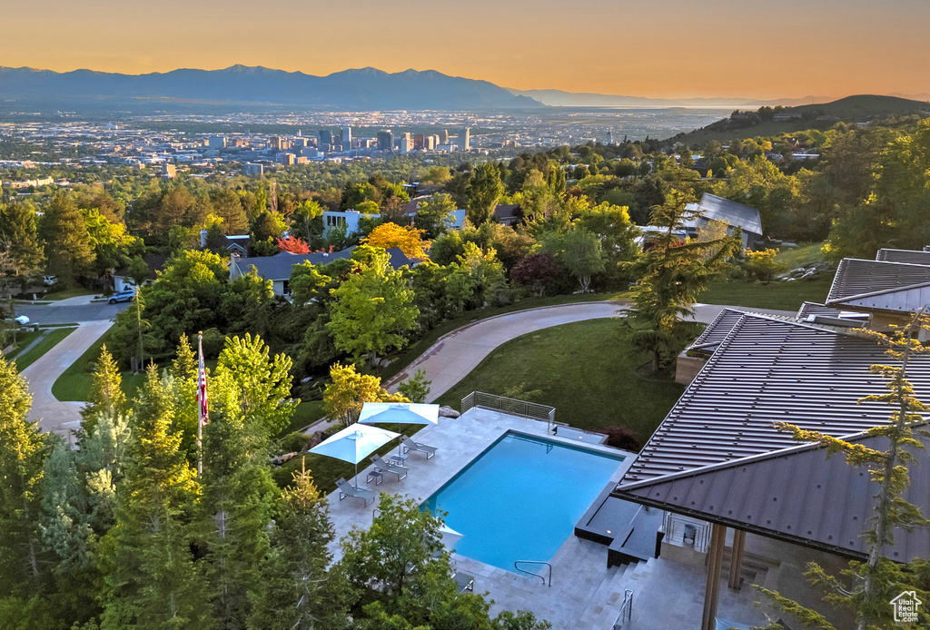 Aerial view at dusk featuring a mountain view