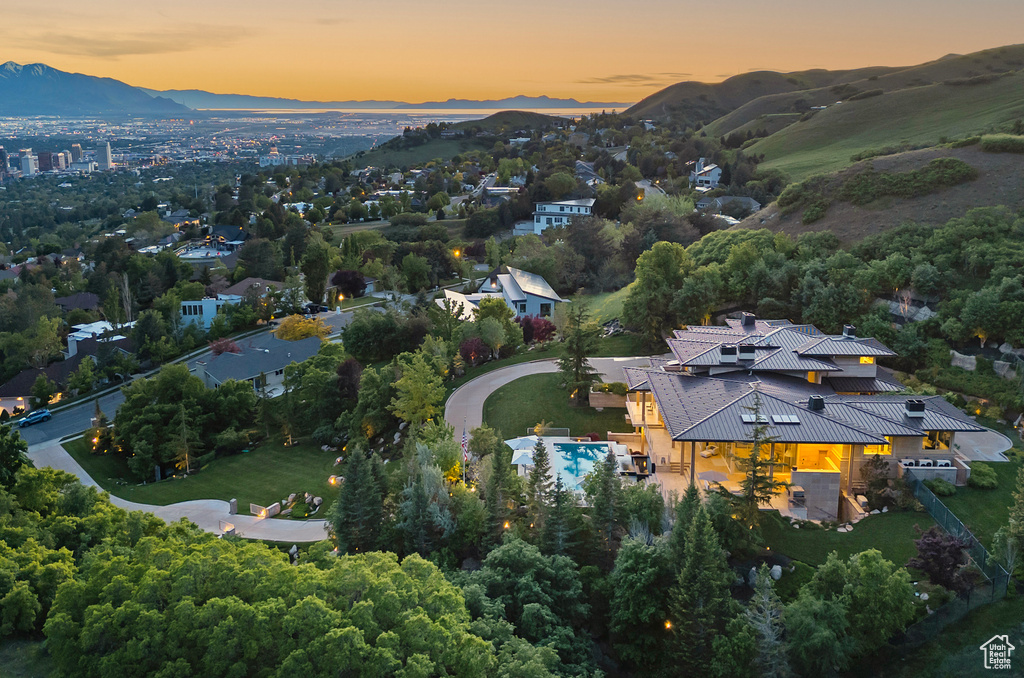 Aerial view at dusk featuring a mountain view