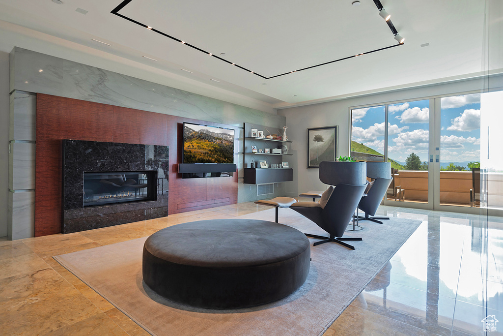 Tiled living room with a high end fireplace