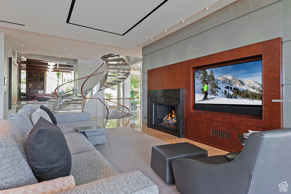 Living room with a healthy amount of sunlight and a fireplace