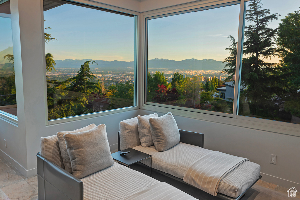 Sunroom / solarium featuring a mountain view