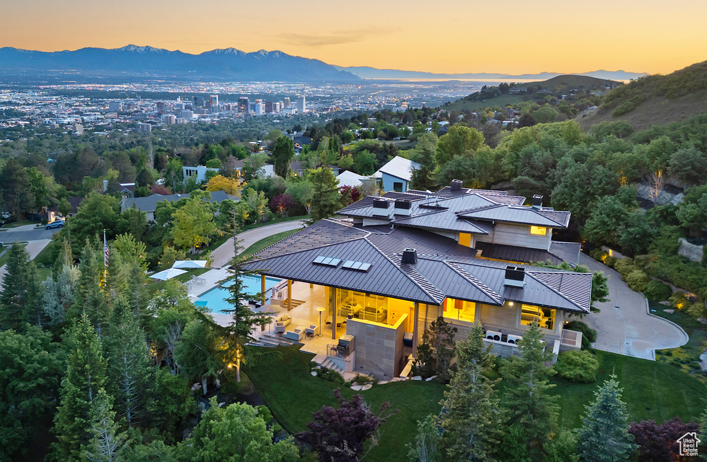 Aerial view at dusk featuring a mountain view