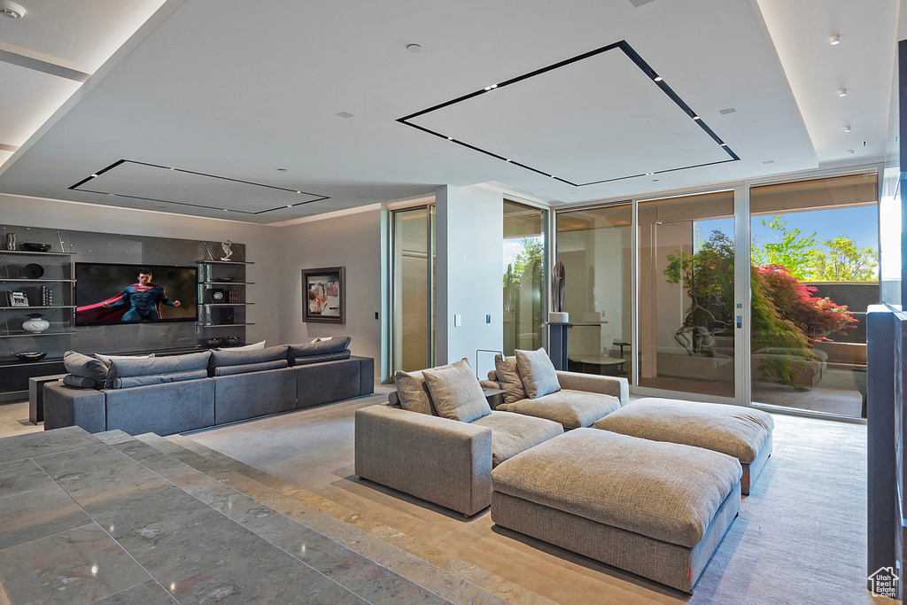 Living room featuring floor to ceiling windows