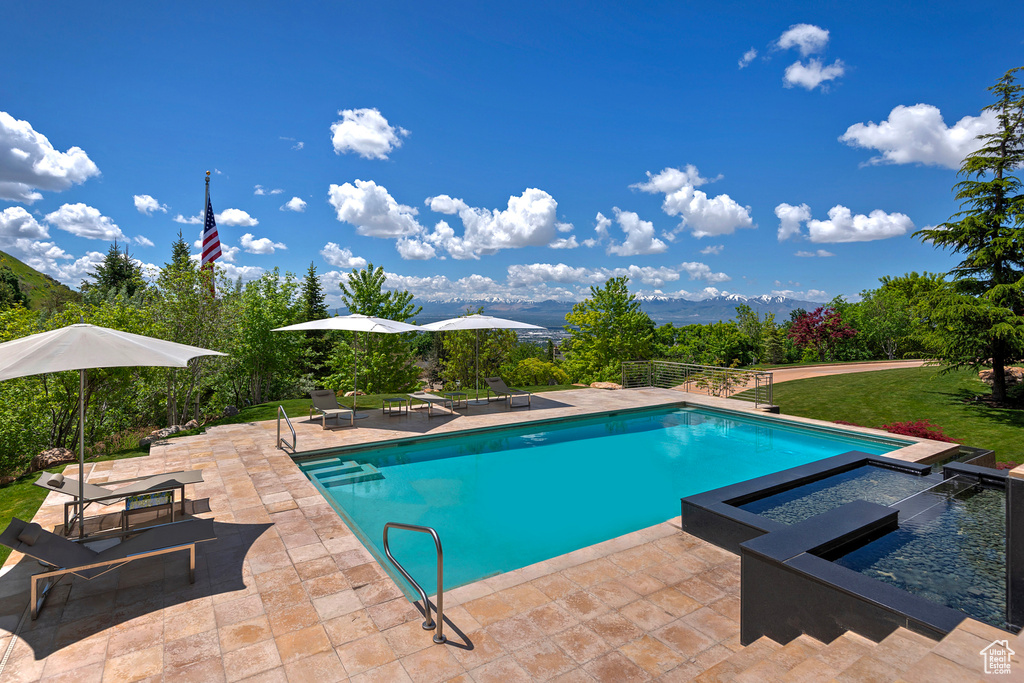 View of swimming pool with a patio area