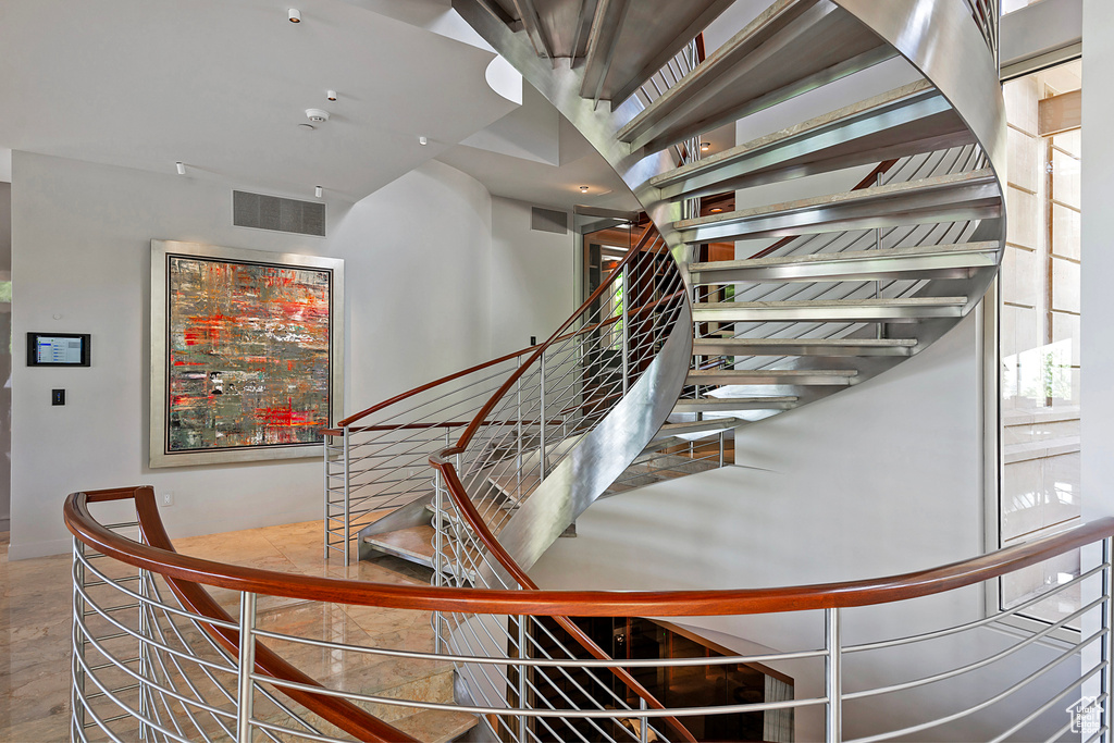 Stairs with hardwood / wood-style floors