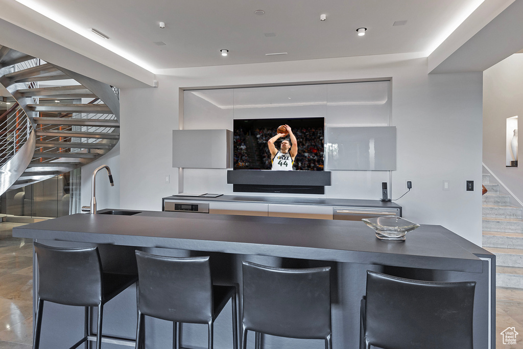 Interior space featuring sink and tile flooring