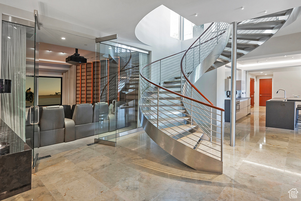 Stairs with sink and light tile floors