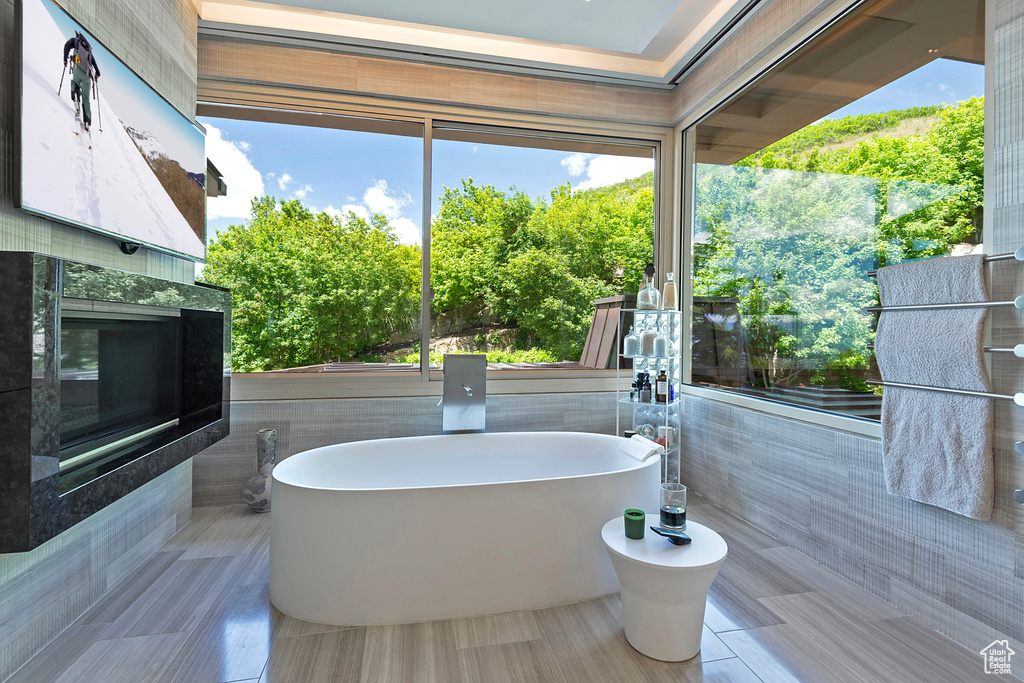 Bathroom with tile walls and tile flooring