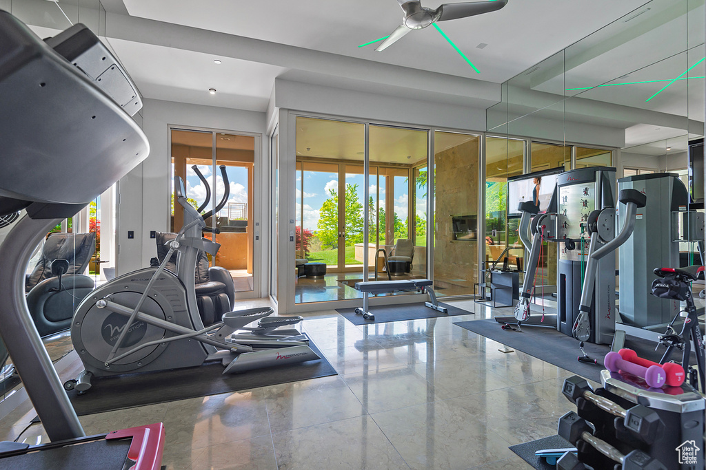 Gym featuring ceiling fan and a wealth of natural light