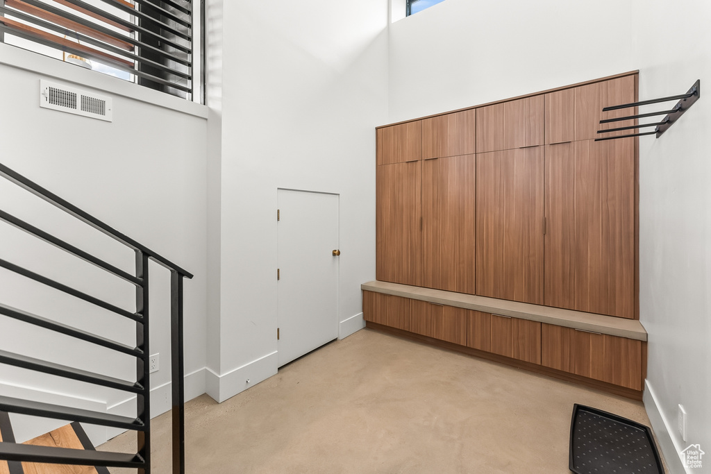 Entrance foyer featuring a towering ceiling