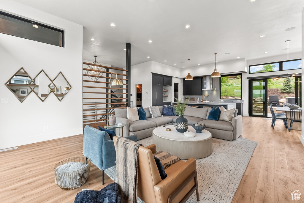 Living room with light hardwood / wood-style floors