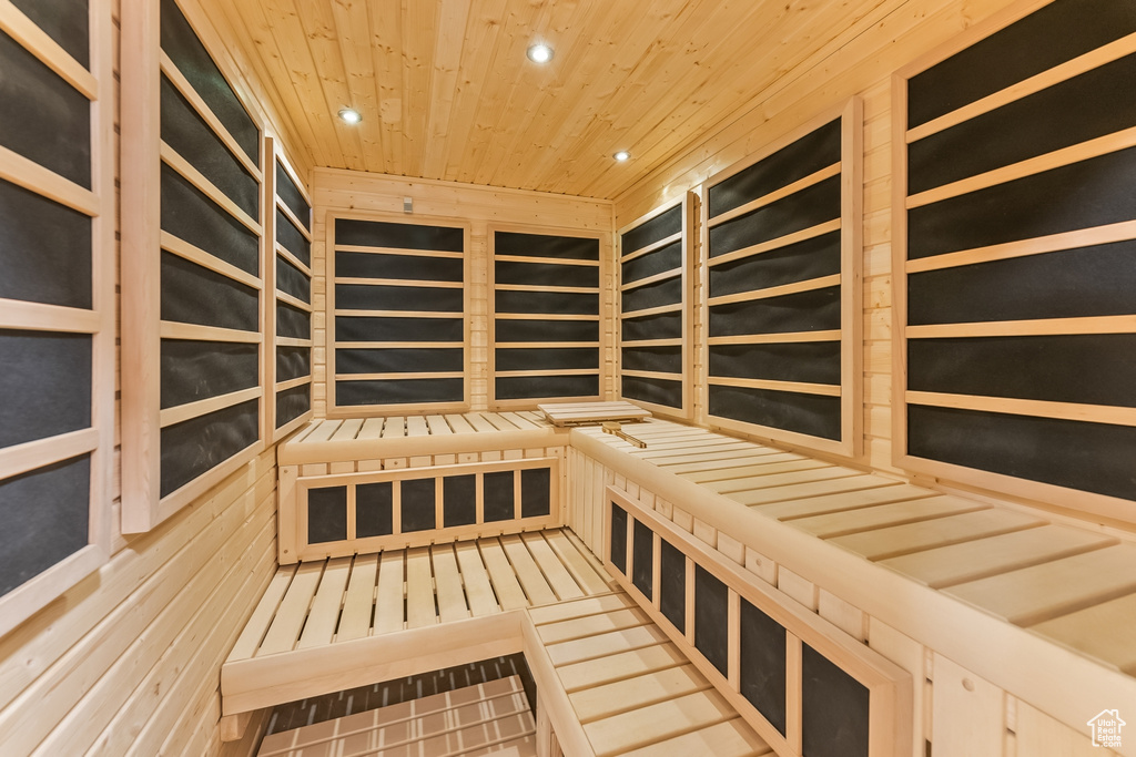 View of sauna with tile floors and wood ceiling