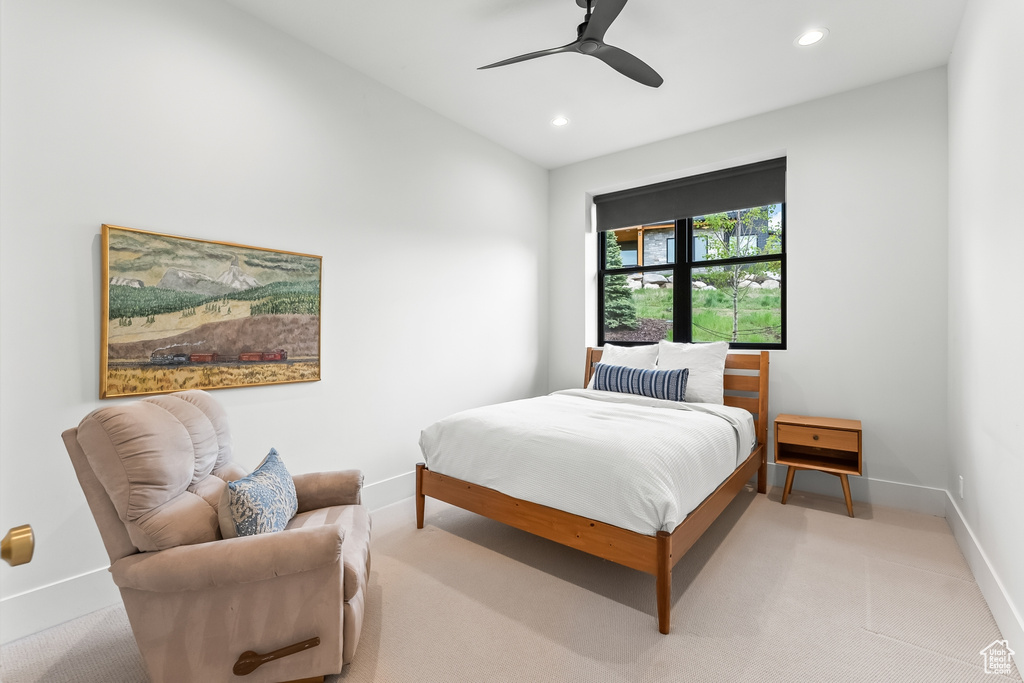 Bedroom featuring ceiling fan and carpet floors