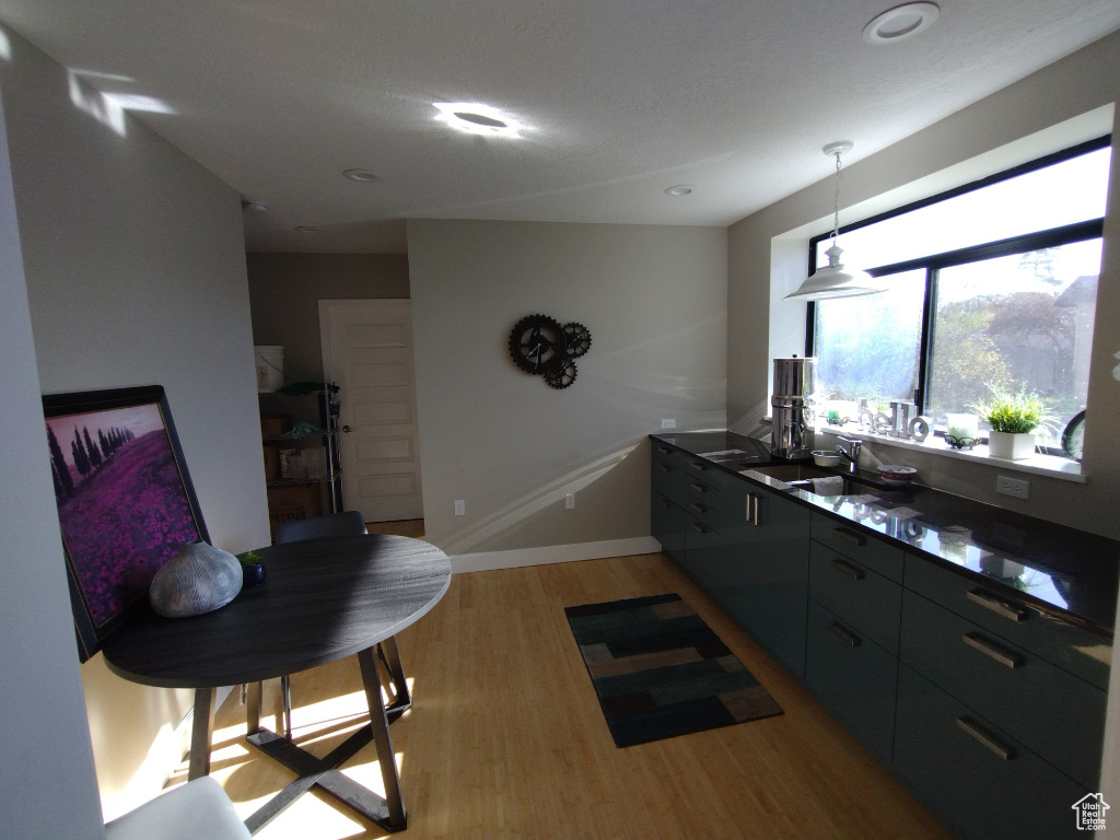 Kitchen with sink and light wood-type flooring