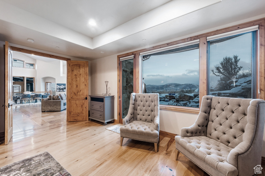 Living area with hardwood / wood-style floors