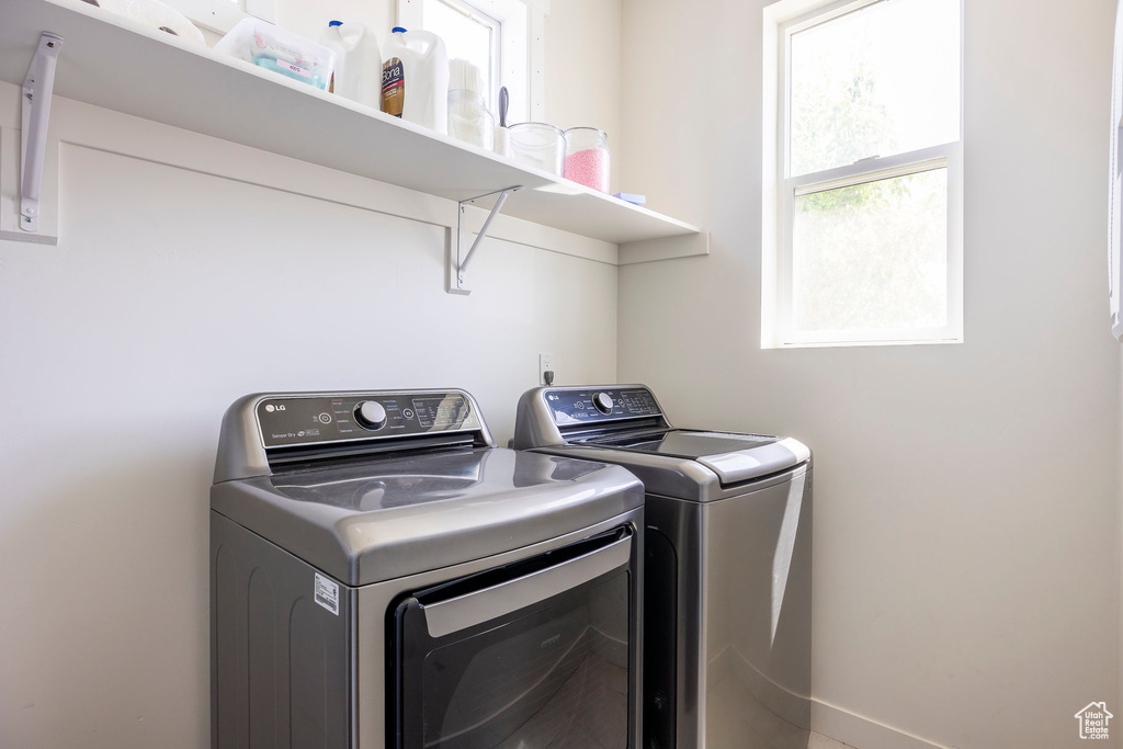 Washroom featuring washing machine and dryer