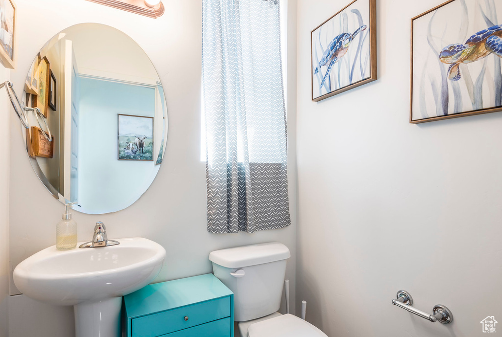 Bathroom featuring sink and toilet