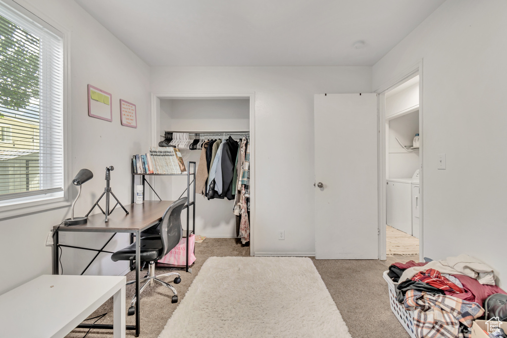 Interior space featuring a closet and independent washer and dryer