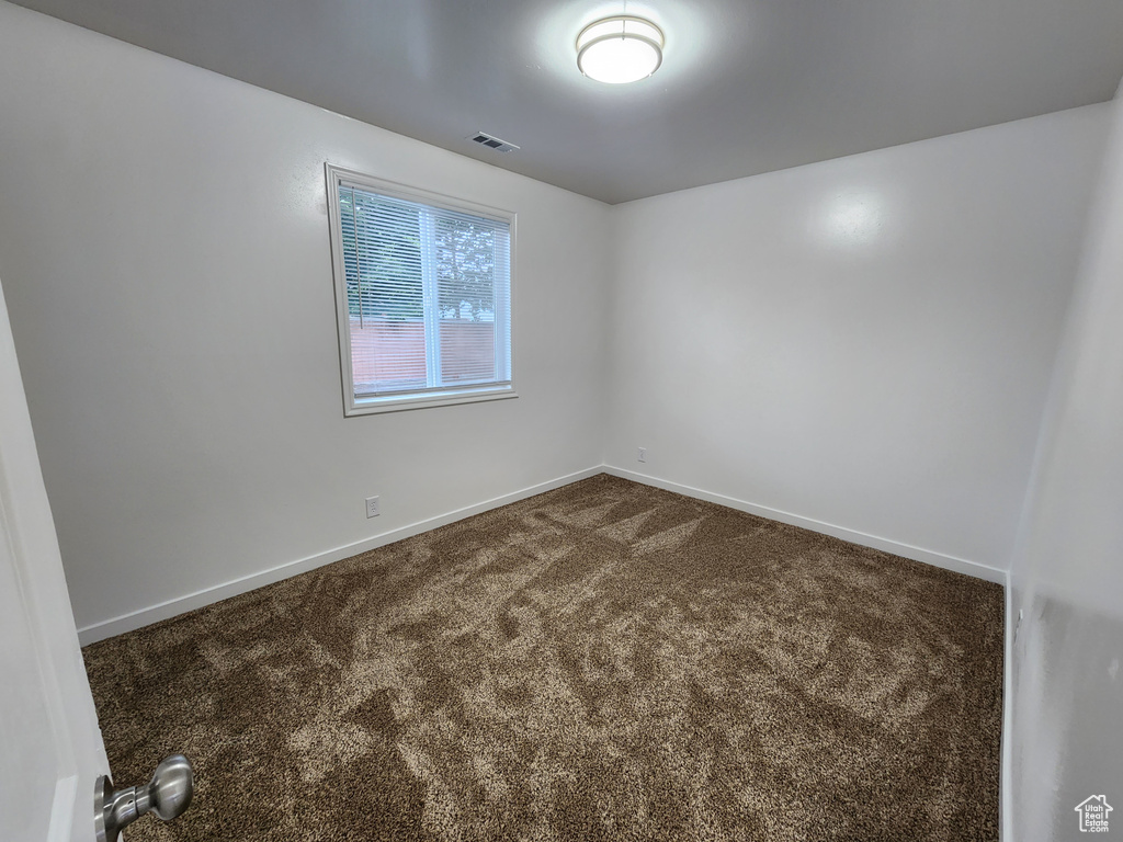 Empty room featuring carpet