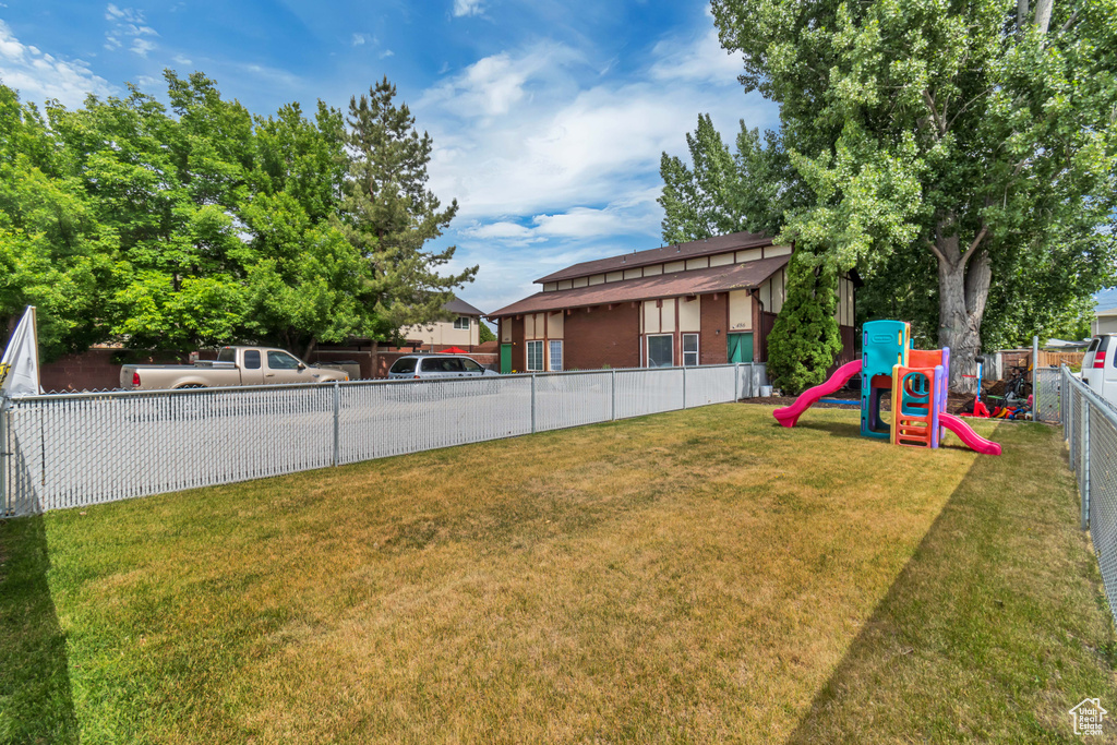 View of yard featuring a playground