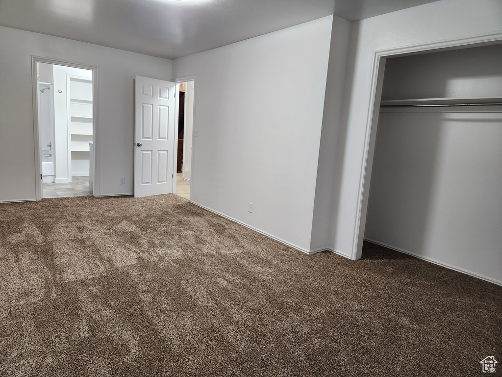 Unfurnished bedroom with carpet floors