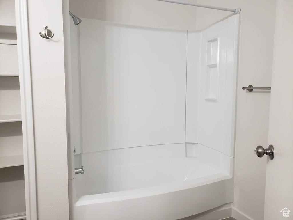 Bathroom featuring washtub / shower combination