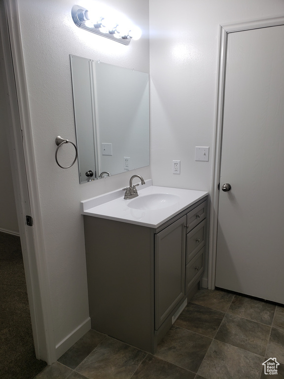 Bathroom with tile flooring and vanity