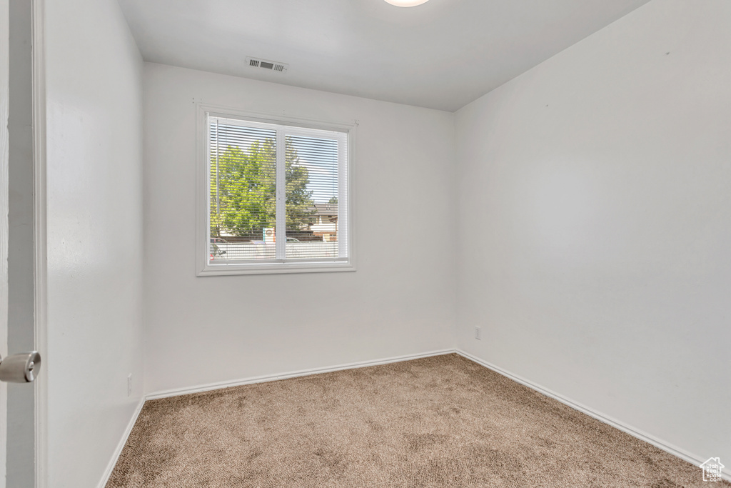 View of carpeted spare room