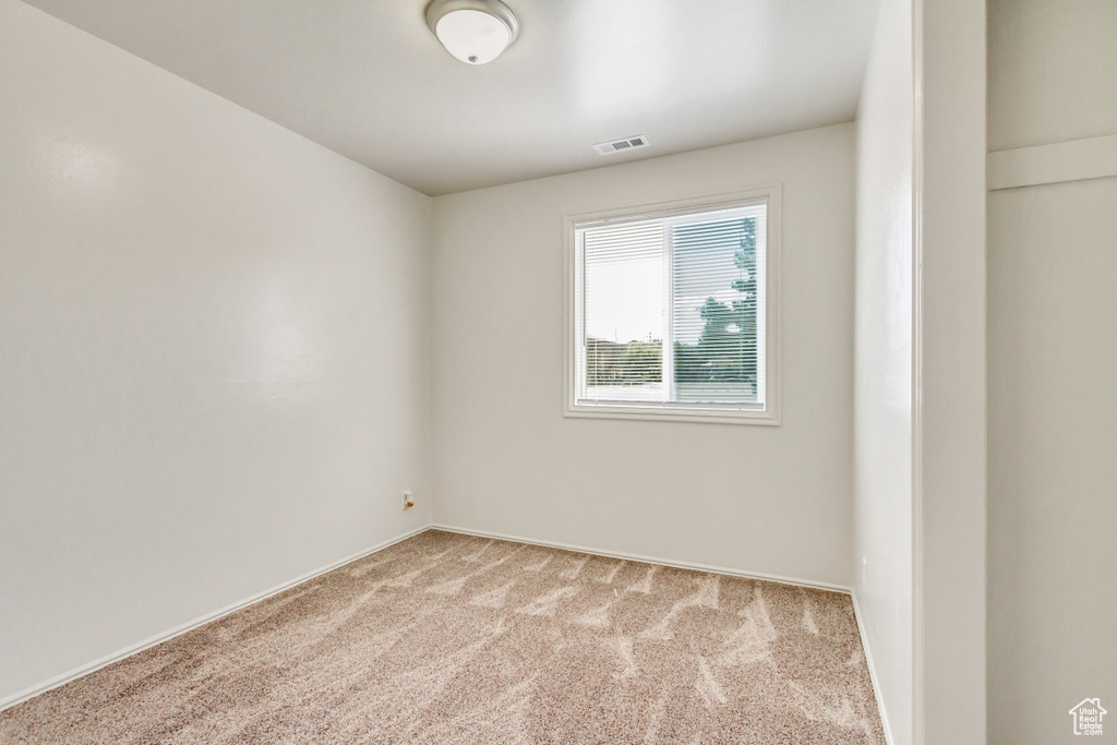 View of carpeted spare room