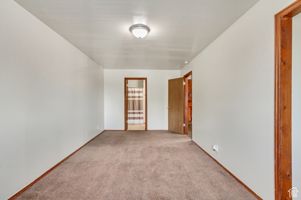 Unfurnished room with carpet floors