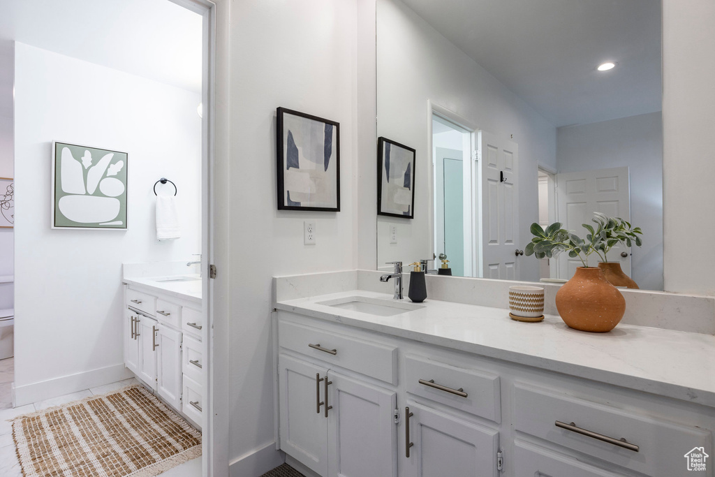 Bathroom featuring vanity and tile patterned flooring