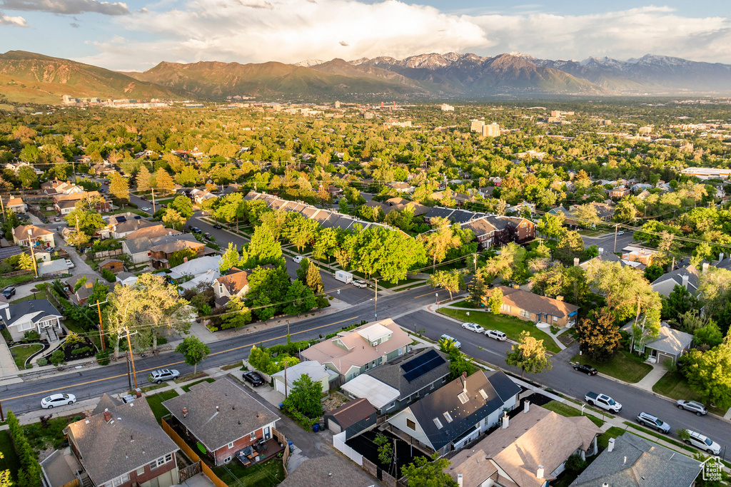 Birds eye view of property with a mountain view