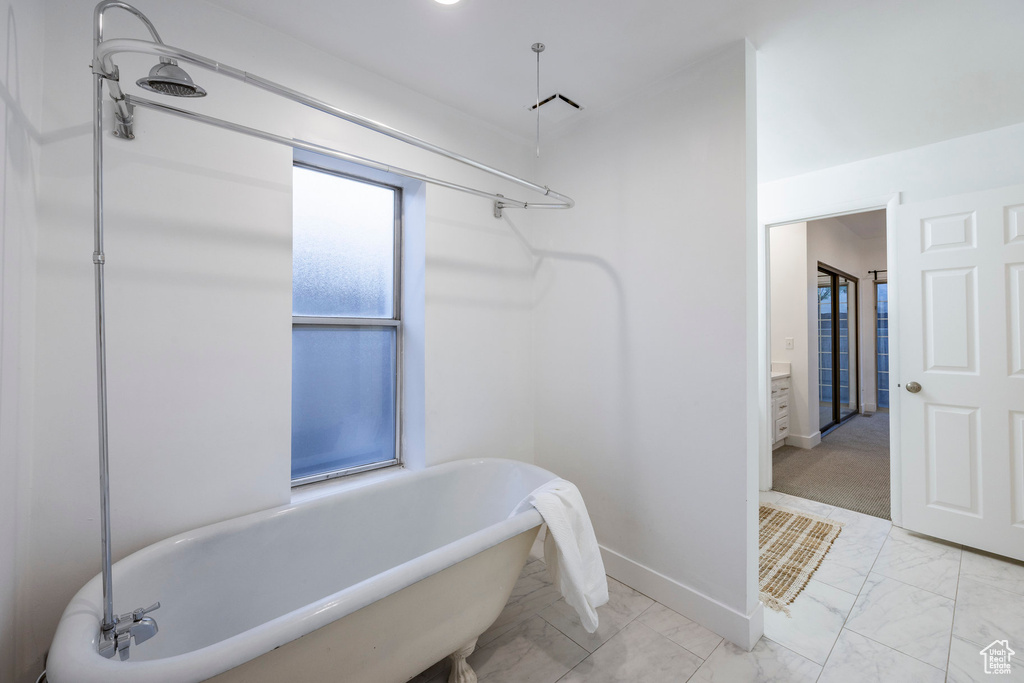 Bathroom with tile patterned floors