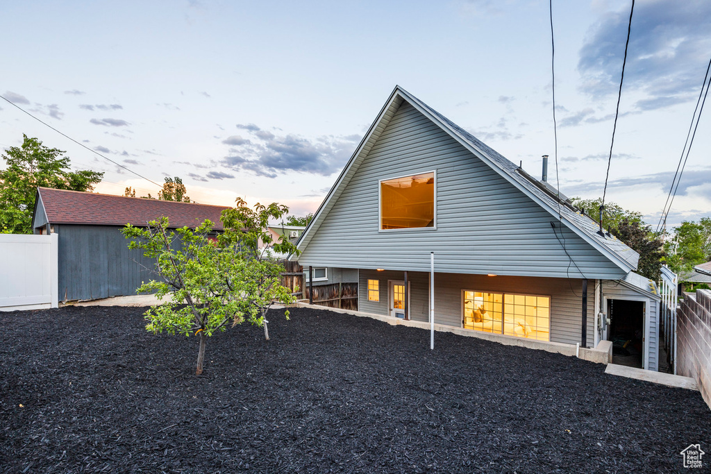 View of property exterior at dusk