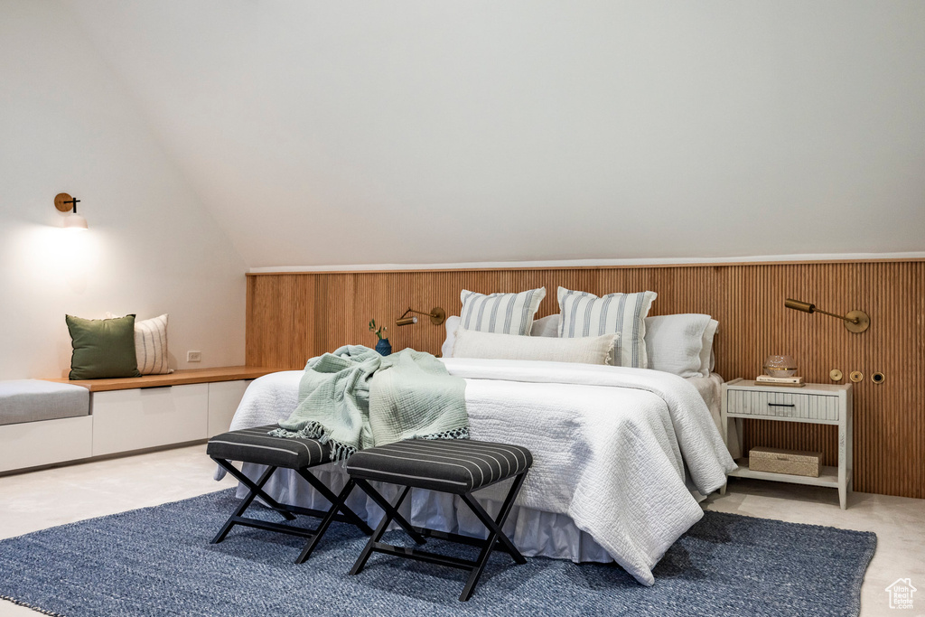 Bedroom featuring lofted ceiling