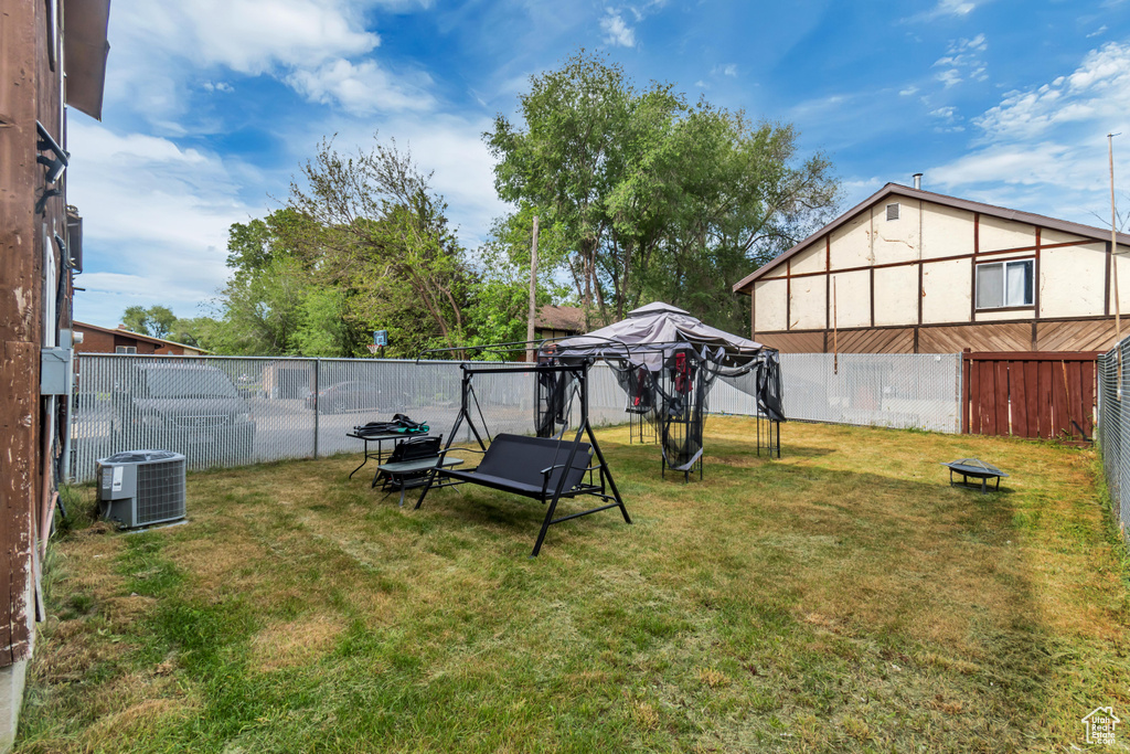 View of yard with central AC unit