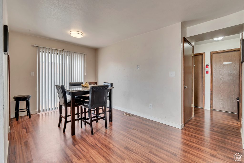 Dining space featuring dark hardwood / wood-style flooring