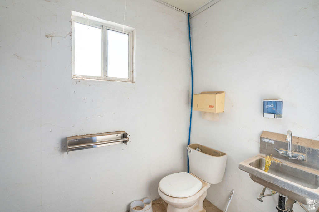 Bathroom featuring sink and toilet