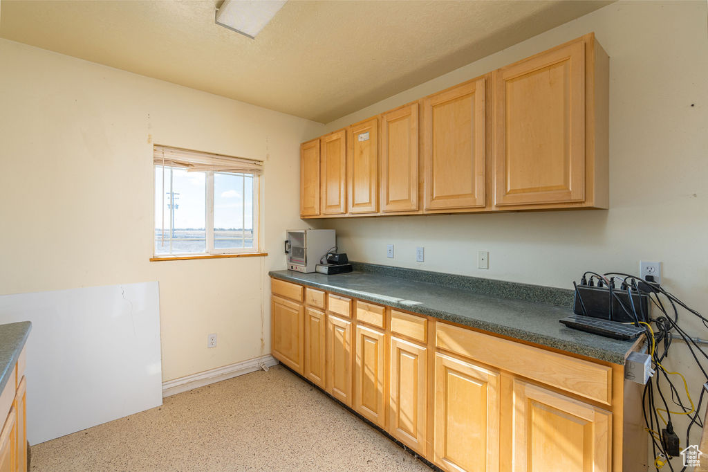 Kitchen with light brown cabinets