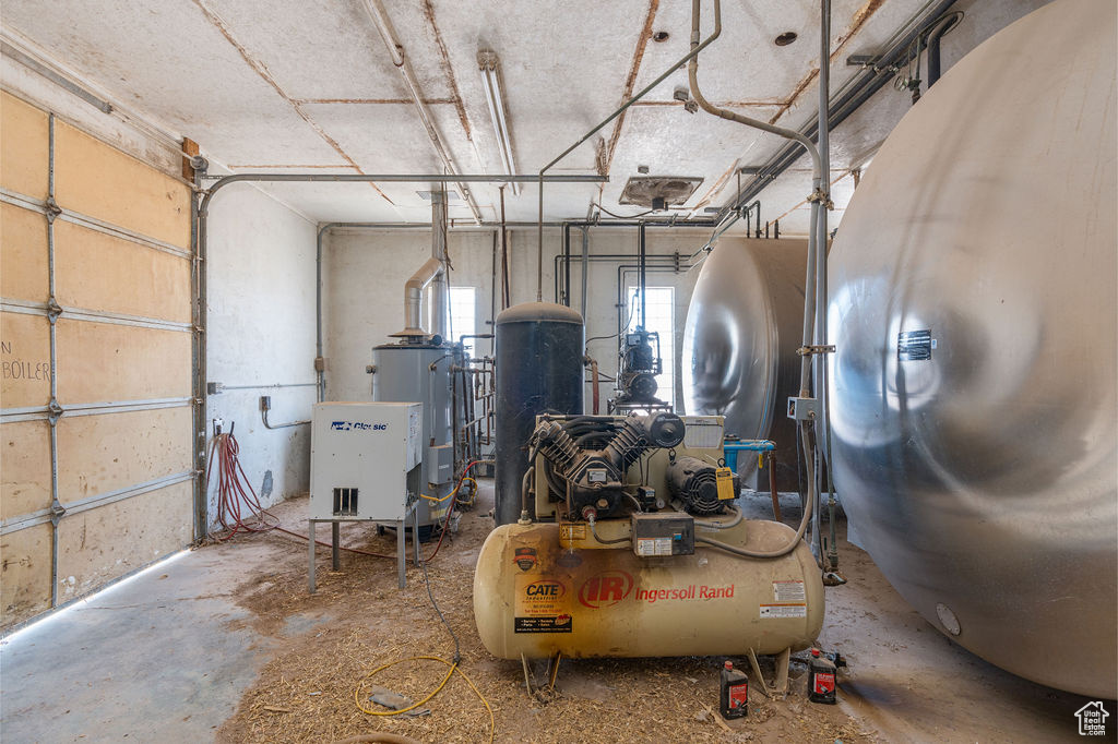 Garage featuring electric water heater