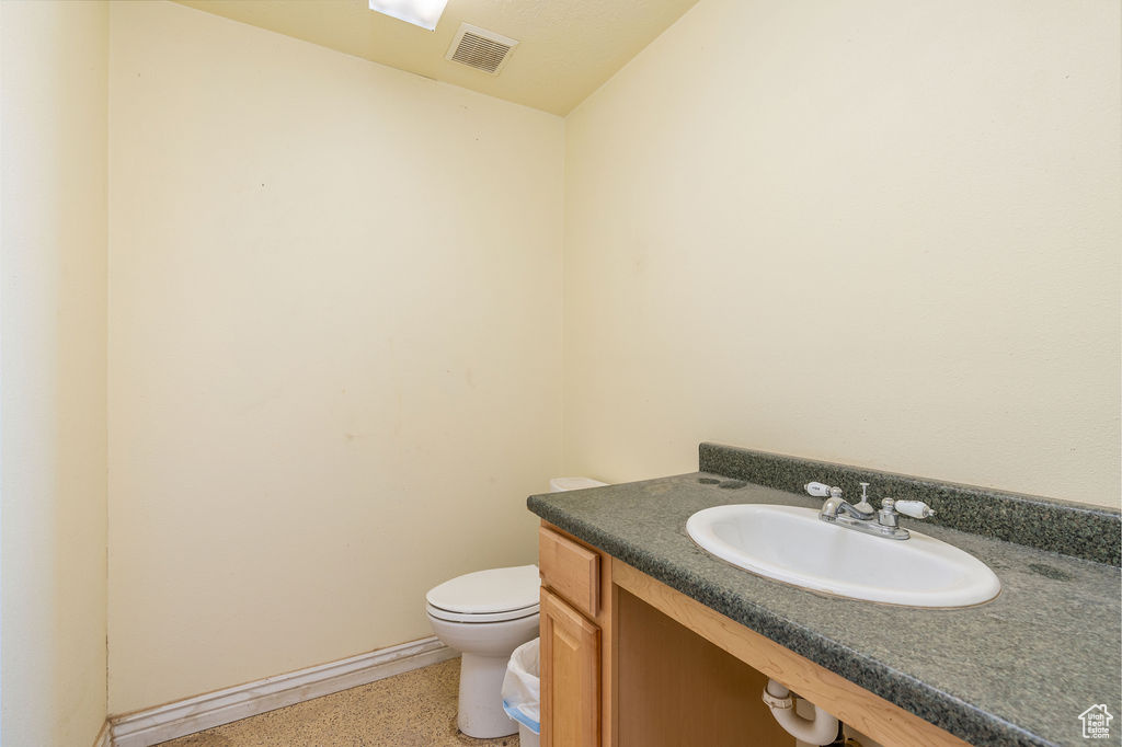 Bathroom with toilet and vanity